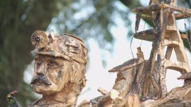 A close-up of a wood carving
Description automatically generated